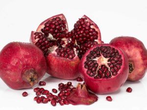 Bunch of pomegranates on a white background