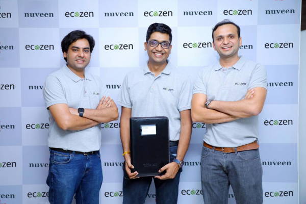 3 ecozen directors posing for the camera. Centre one holding a file.